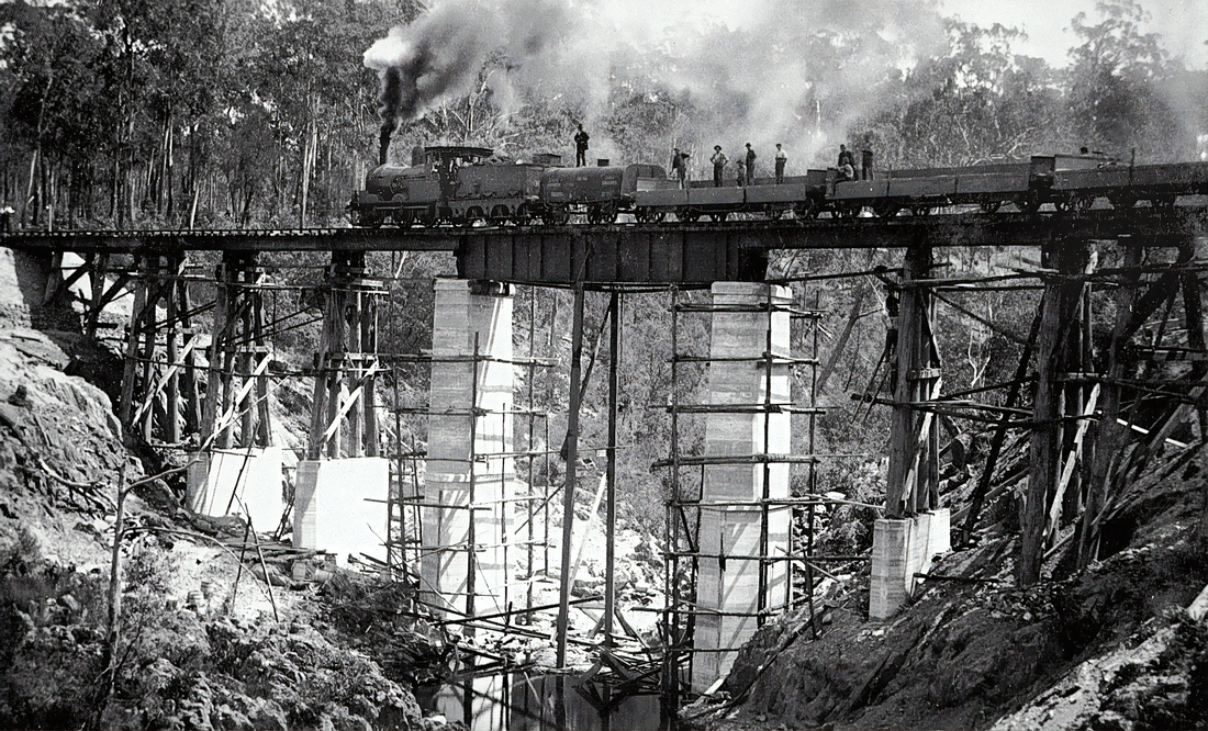 black and white railroad with train