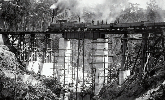 black and white railroad with train